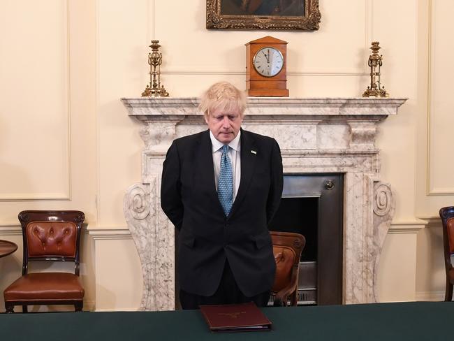 Britain's Prime Minister Boris Johnson pauses for a minute's silence. PICTURE: AFP