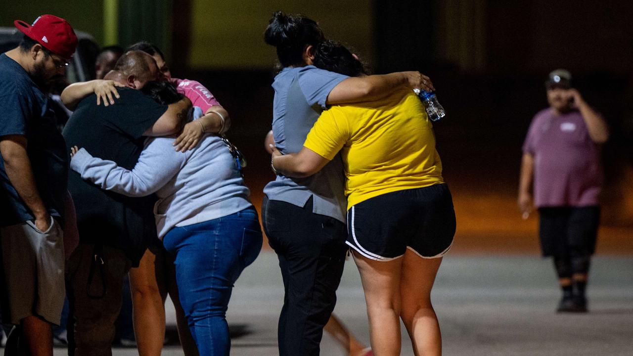 A family grieves following the mass shooting. Picture: Brandon Bell/Getty Images/AFP