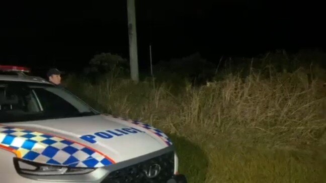 Police walk to the scene of a fatal plane crash near Peachester