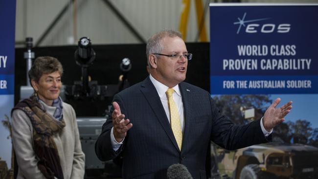 Prime Minister Scott Morrison (right) and Liberal candidate for Eden-Monaro Fiona Kotvojs tour Electro Optics Sydneys (EOS) in Canberra. Picture: Sean Davey