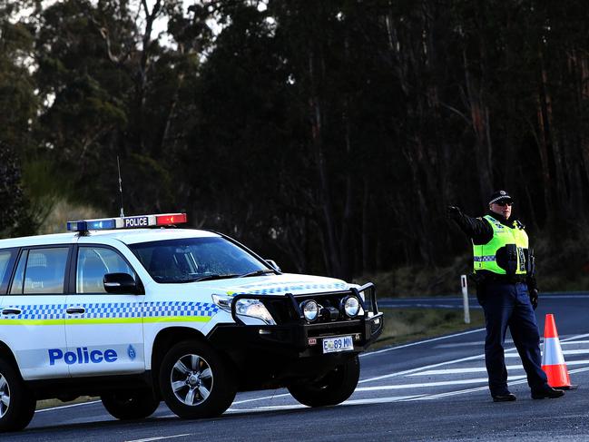 Police road block at the turn off to Waratah on the Murchison Highway after a fatal motor vehicle crash.