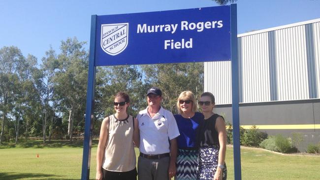 Regional school sports administrator Murray Rogers with the field named after him at Central State School. Murray is with wife Laurel and daughters Sara and Angie. Photo: Contributed