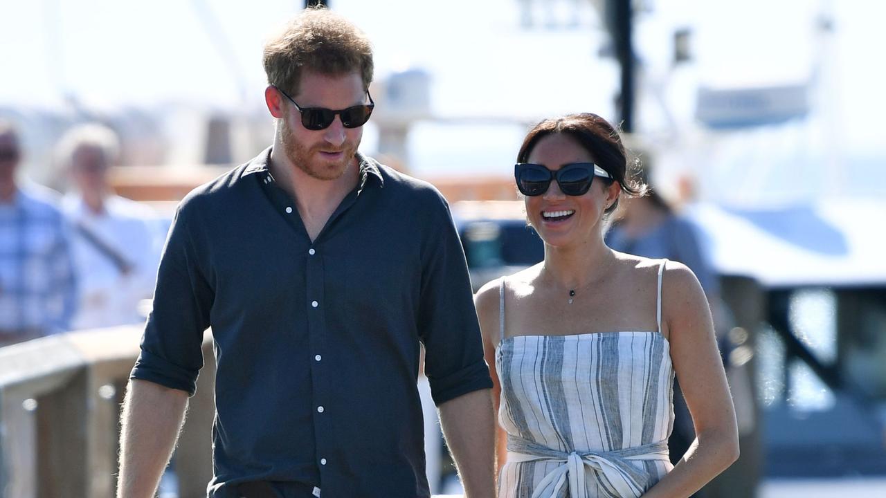 Harry and Meghan on their first royal tour as a married couple in Australia last year. Picture: Darren England/Pool/AFP