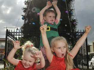 Phoebe Gilmour (3), Lochie Ryan (4) and Georgia Ryan (5) in front of large Christmas tree in the CBD. . Picture: Dave Noonan