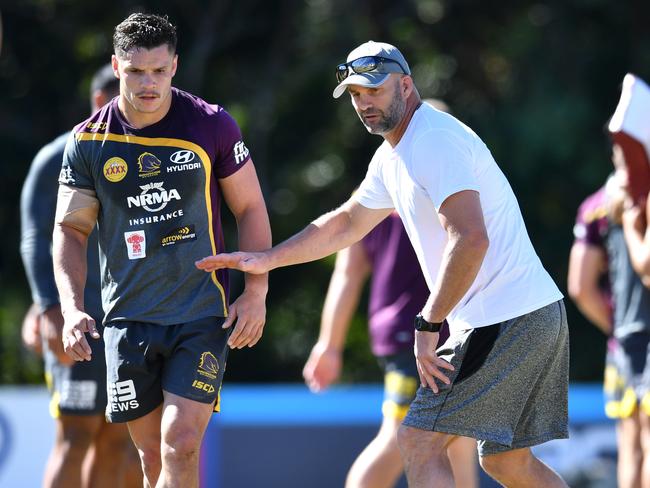 James Roberts (left) and former Broncos player Peter Ryan during the Brisbane Broncos training session on Monday.