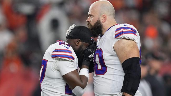 (FILES) In this file photo taken on January 2, 2023, Tre'Davious White, #27, and Mitch Morse, #60 of the Buffalo Bills, react to teammate Damar Hamlin, #3, collapsing after making a tackle against the Cincinnati Bengals during the first quarter at Paycor Stadium in Cincinnati, Ohio. - The on-field cardiac arrest suffered by Buffalo Bills safety Damar Hamlin may have been the result of a "perfect storm" of events in which a blow to the chest was combined with a split-second moment of vulnerability during a heartbeat, experts said on January 4, 2023. (Photo by Dylan Buell / GETTY IMAGES NORTH AMERICA / AFP)