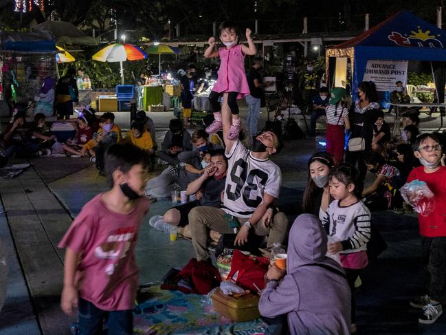 Filipinos spend New Year's Eve at an amusement park in Quezon city, Metro Manila despite a surge in Covid cases. Picture: Getty Images