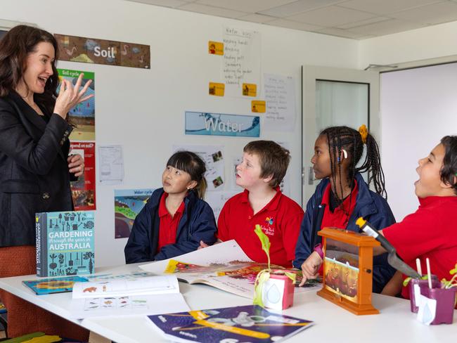 Principal Lee Bullock communicating in Auslan with students Krystal, Xavier, Betselot and Izayah. Picture: Mark Stewart