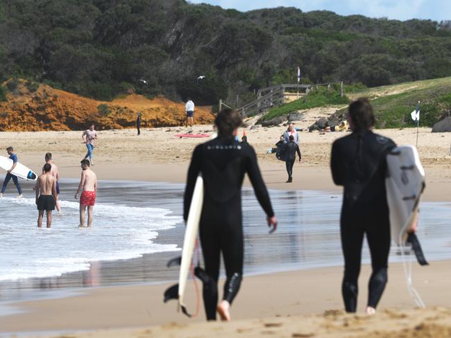 Official coronavirus social-distancing advice did little to dissuade beachgoers at Torquay, with both Saturday and Sunday busy on the shores and in the water of the town's main surf beach. Pictures: SHAUN VILJOEN