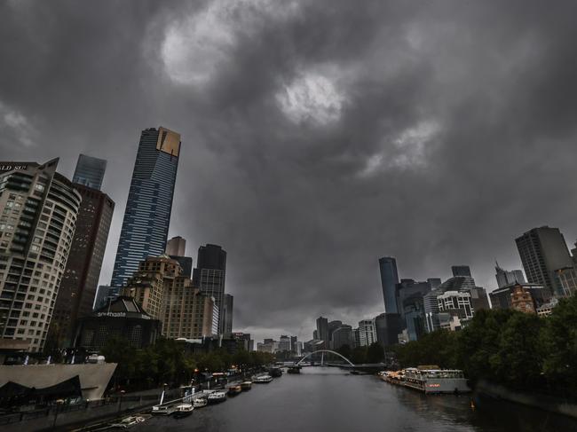 Storm clouds cloak Melbourne into the dark and wet conditions.                      Picture: David Caird