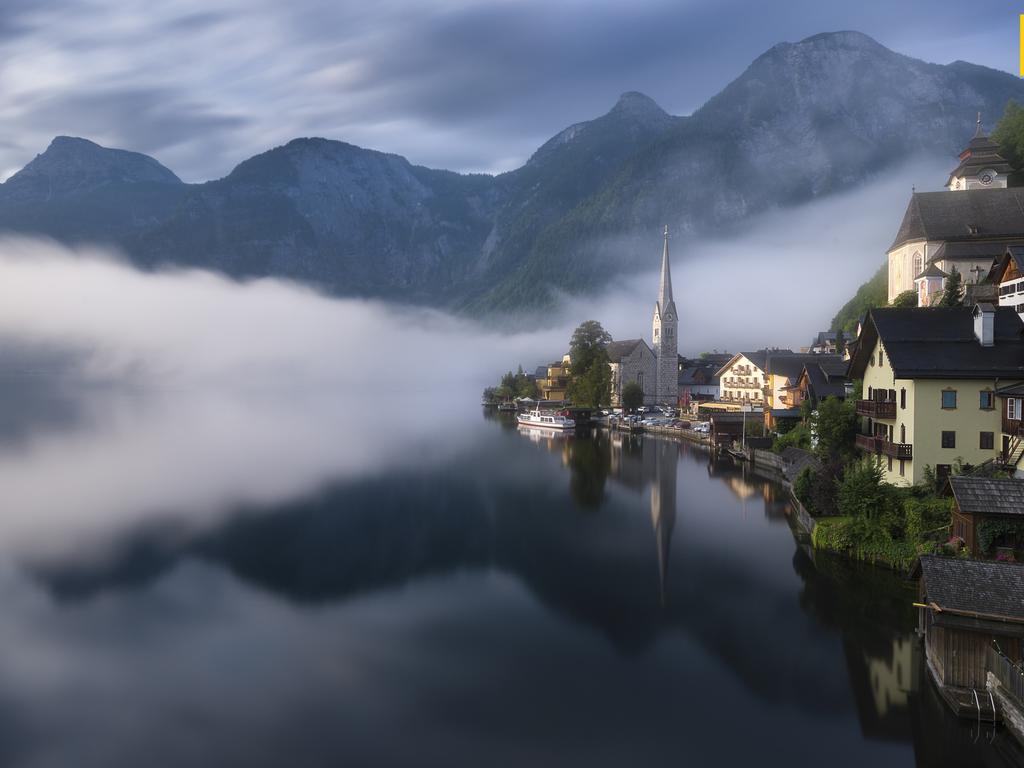 Photo by Shanof K. / National Geographic Nature Photographer of the Year contest A Beautiful Morning in Hallstat The image was taken from Hallstat Village in Austria right after sunrise. I had to walk some distance to reach this village view point. It was worth every step that I took as the scene turned out to be magical with the fog movement. Luckily the fog did not cover up the mountains.