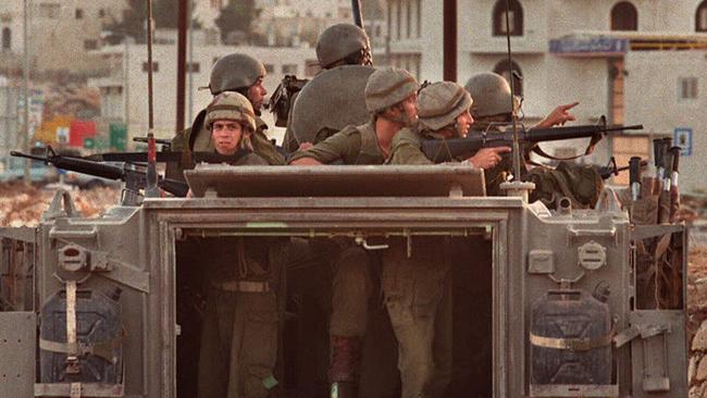 Israeli soldiers on armoured personnel carriers near Ramallah, on West Bank of Gaza Strip.