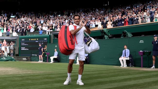 Roger Federer of Switzerland walks off court after losing his men's Singles Quarter Final match against Hubert Hurkacz of Poland.