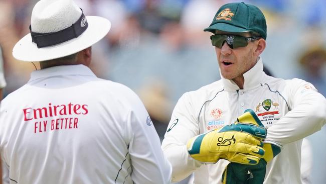 Tim Paine of Australia speaks with umpire Marais Erasmus.