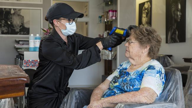 Perth hairdresser and Australian Institute of Trichology founder Simone Lee with client Elaine Shellam. Ms Lee wants salons to be shut down for health and safety reasons. Picture: Ross Swanborough