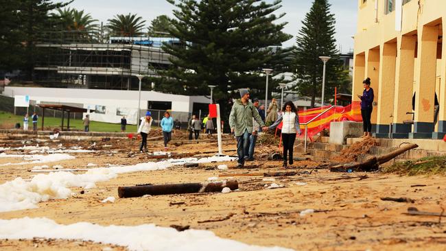 Debris litters the beach in front of Collaroy Surf Club. Picture: John Grainger