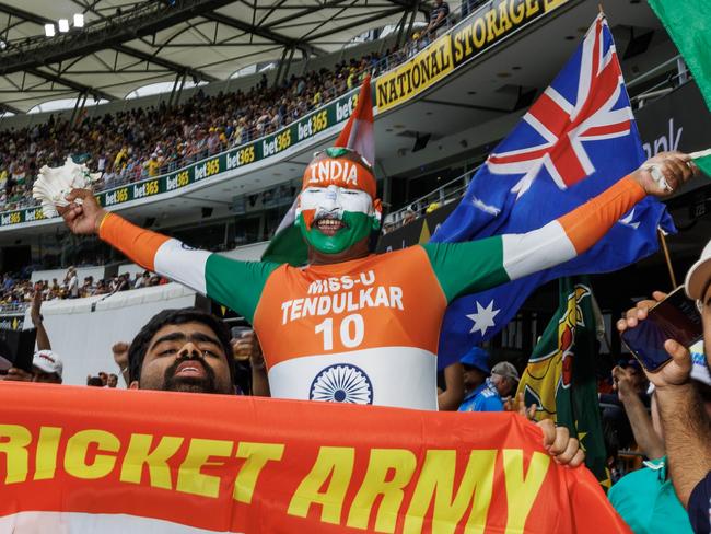 Indian fans celebrate the wicket of Marnus Labuschagne on the second day of the test between India and Australia at The Gabba. Picture Lachie Millard