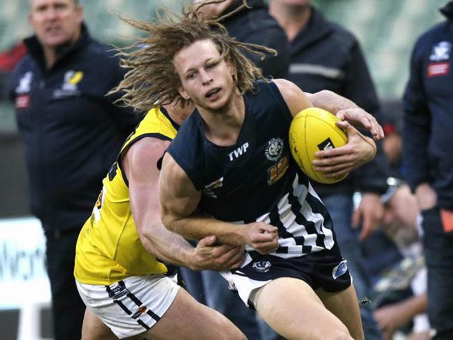 Interleague: Geelong Football League v Mornington Peninsula Nepean FL Campbell Floyd tackled by Luke Tapscott Picture:Wayne Ludbey