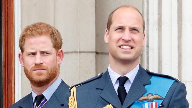 LONDON, UNITED KINGDOM - JULY 10: (EMBARGOED FOR PUBLICATION IN UK NEWSPAPERS UNTIL 24 HOURS AFTER CREATE DATE AND TIME) Prince Harry, Duke of Sussex and Prince William, Duke of Cambridge watch a flypast to mark the centenary of the Royal Air Force from the balcony of Buckingham Palace on July 10, 2018 in London, England. The 100th birthday of the RAF, which was founded on on 1 April 1918, was marked with a centenary parade with the presentation of a new Queen's Colour and flypast of 100 aircraft over Buckingham Palace. (Photo by Max Mumby/Indigo/Getty Images)