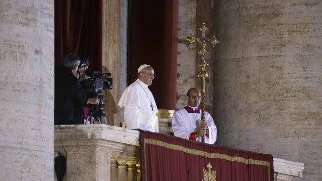 Pope Francis looks out to the crowd from the central balcony of St Peter’s Basilica after being elected 266th pontiff in 2013. Picture: Luca Bruno/AP