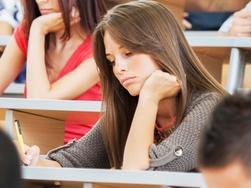 RendezView. Group of college students in the university amphitheatre, they are sitting and doing an exam. (Pic: iStock)