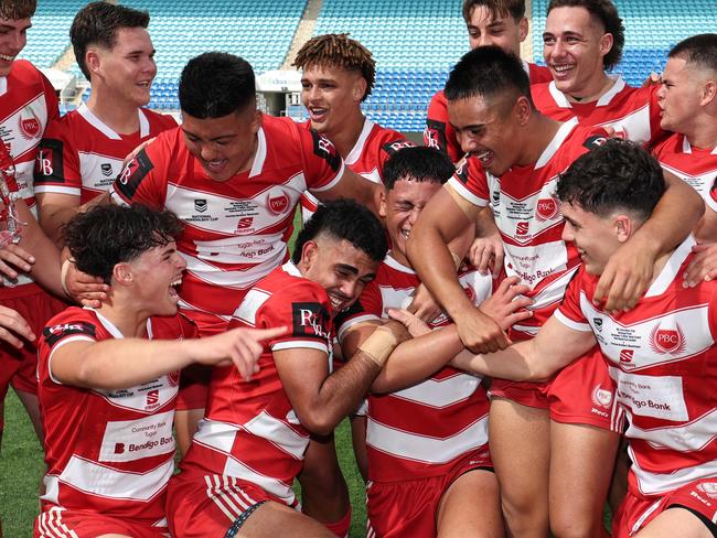 NRL National Schoolboys Cup final at CBUS Stadium  between Palm Beach Currumbin and Patrician Blacktown Brothers. The Red Army and Palm Beach Currumbin players celebrate the win.  .Picture Glenn Hampson