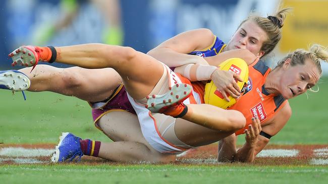 Elle Bennetts is tackled by Greta Bodey of the Lions during the round four AFLW match between the Brisbane Lions and the GWS Giants. Pic: AAP/Albert Perez.