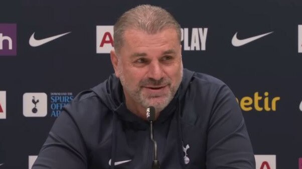 Ange Postecoglou speaks to reporters.