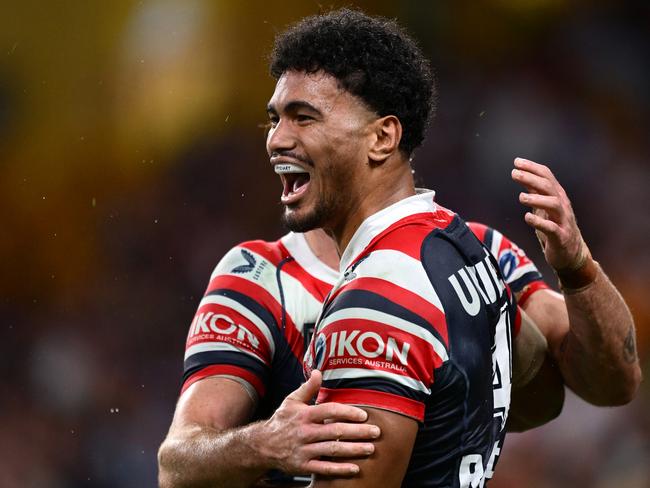 BRISBANE, AUSTRALIA - MAY 02: Robert Toia of the Roosters celebrates with team mates after scoring a try during the round nine NRL match between the Sydney Roosters and Dolphins at Suncorp Stadium on May 02, 2025, in Brisbane, Australia. (Photo by Hannah Peters/Getty Images)
