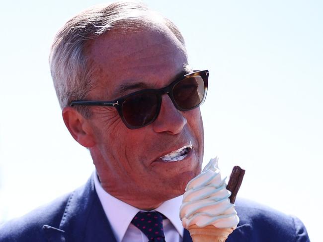 Mr Farage eats a flake ice cream in Clacton-on-Sea on election day. Picture: AFP