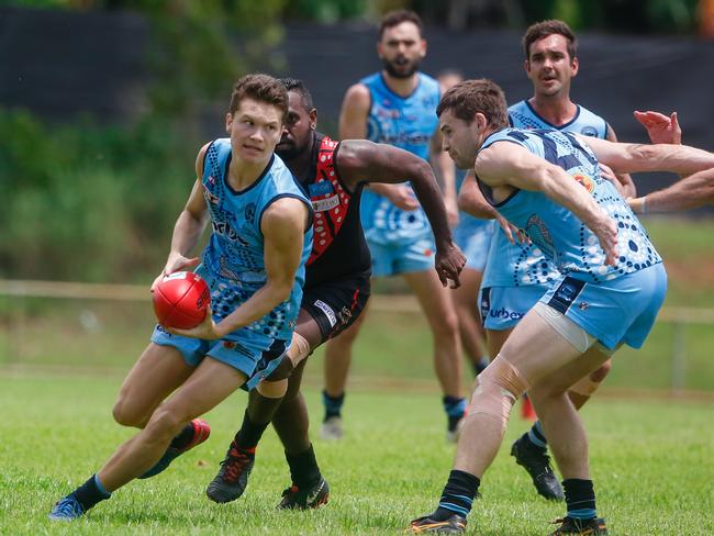 Buff's Isaac Seden-Kurnoth (Ball) as Tiwi Bombers V Darwin Buffaloes at Tracey Village.Picture GLENN CAMPBELL