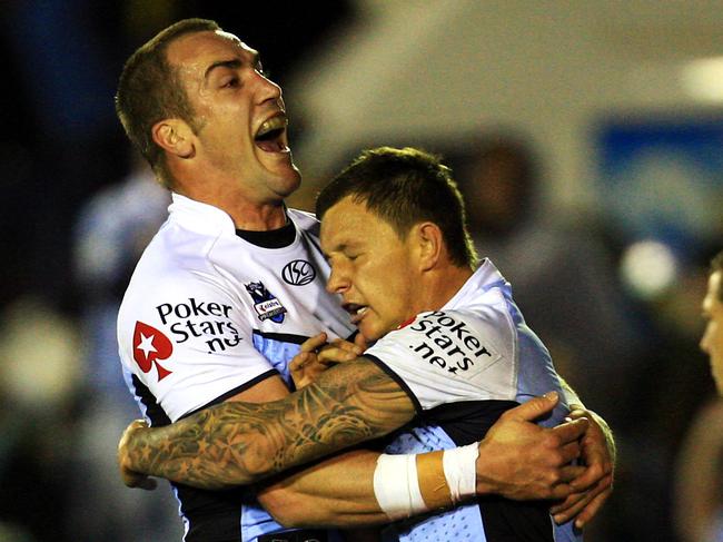 Luke Covell celebrates a try for Cronulla.