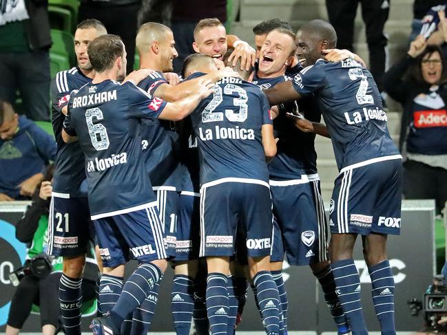 MELBOURNE, AUSTRALIA - FEBRUARY 25: Marco Rojas of the Victory is congratulated by Besart Berisha and his teammates after scoring the first goal during the round 21 A-League match between Melbourne Victory and Adelaide United at AAMI Park on February 25, 2017 in Melbourne, Australia. (Photo by Scott Barbour/Getty Images)
