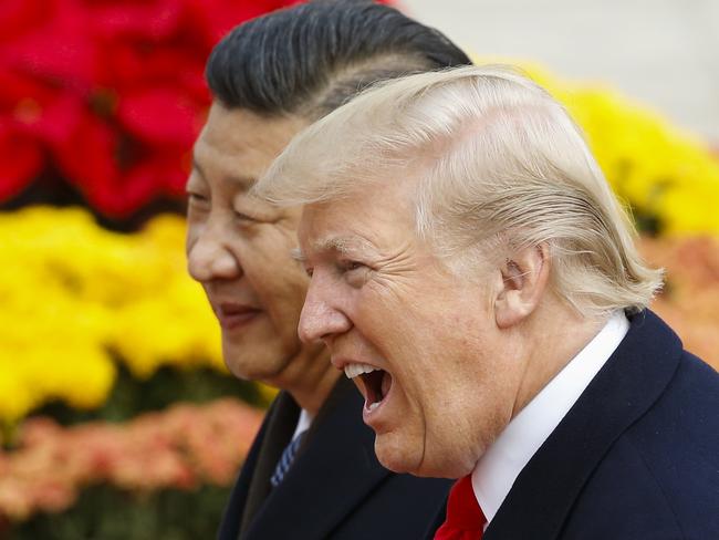 US President Donald Trump takes part in a welcoming ceremony with China's President Xi Jinping in Beijing last year. Picture: Getty