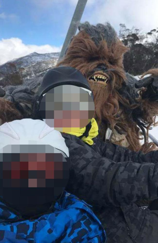 Young skiers pose with Chewie on the ski fields.