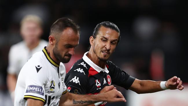 Ivan Franjic and Daniel Georgievski battle in the first derby of the season.