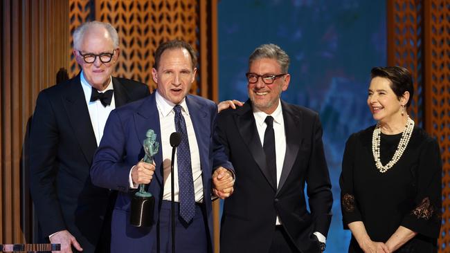 John Lithgow, Ralph Fiennes, Sergio Castellitto, and Isabella Rossellini accept the Outstanding Performance by a Cast in a Motion Picture award for Conclave. Picture: Getty Images