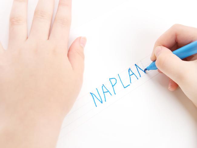 Naplan is an Australian Standardised Test that most school children go through. In this image, preschool child tracing the word NAPLAN. Font used for tracing is my own design,