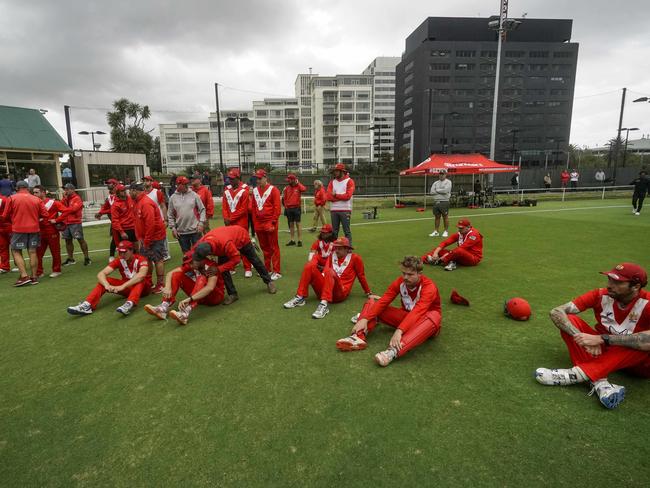 Disappointed Casey South Melbourne players take in the presentation. Picture: Valeriu Campan