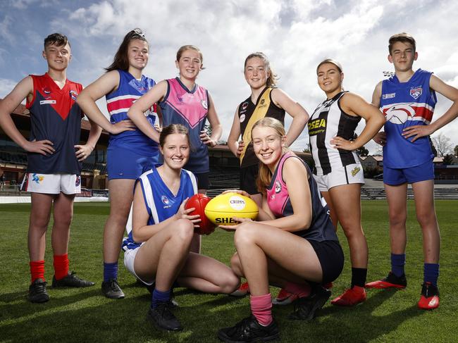 STJFL players ahead of their grand final games this weekend Front LR Sandy Bay's, Sophie Abel, 16 and North Hobart's, Claire Ransom, 16 and (rear) LR Brightson's, Riley Davie, 12, Claremont's Emma Abrahams, 16, North Hobart's Lily McConnon, 13, Kinborough's Neve Hagan,12, Glenorchy's Talia Drake, 16 and Claremont's Jade Clark, 13. Picture: Zak Simmonds