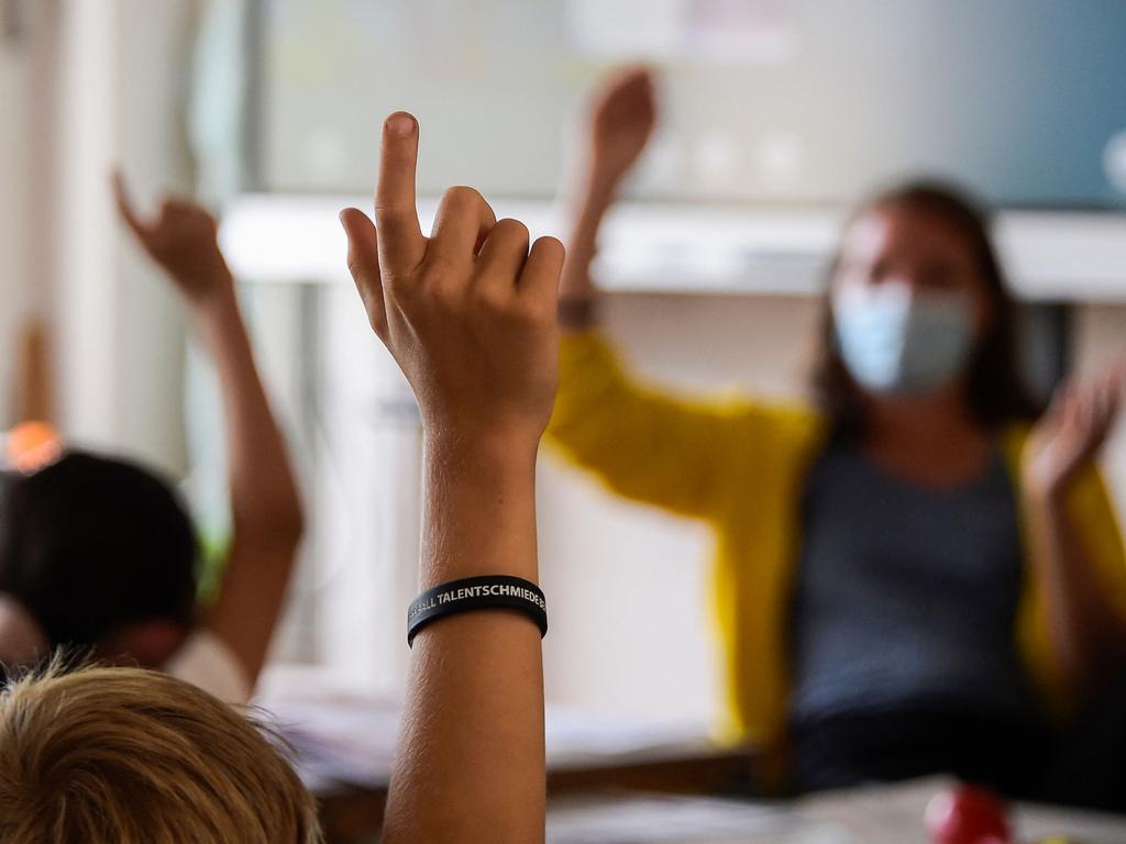 Masks must be worn by staff and students from years 7 to 12 and are strongly encouraged for students in years 3 to 6. Picture: Tobias Schwarz / AFP