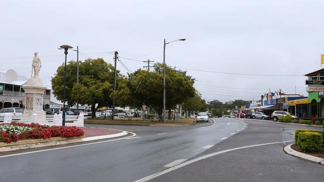 WORKING IN THE WET: Despite the rainy conditions, council workers are pushing through to achieve the targeted deadline for the footpath upgrade project along Lamb St, Murgon. Photo: Laura Blackmore