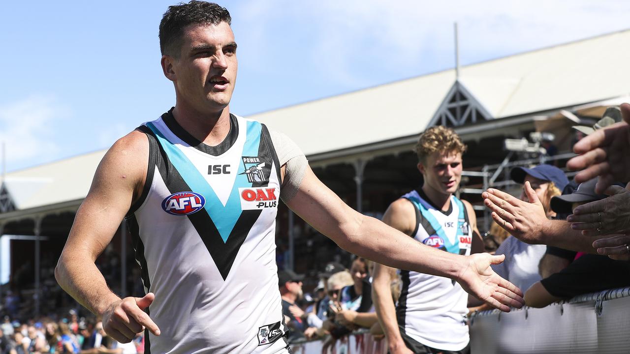 Tom Rockliff celebrates with Port Adelaide fans after the club’s JLT clash. Picture: Sarah Reed 