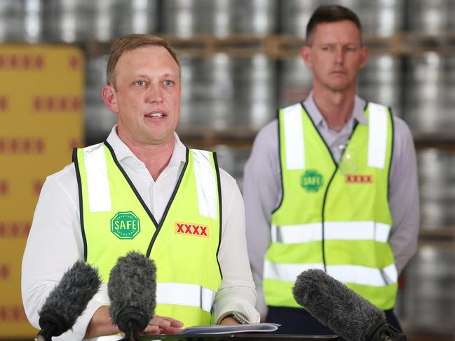 Transport Minister Mark Bailey (rear) crashes Deputy Premier and State Development Minister Steven Miles’ media conference at the XXXX brewery. Picture: Annette Dew