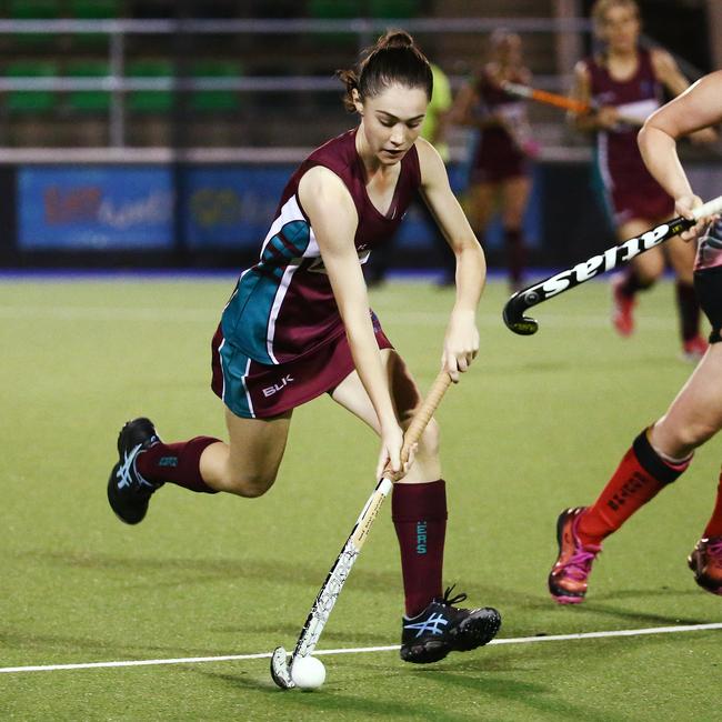 Action from Cairns Hockey A Grade Women's match between the Cairns Brothers and the Cairns South. Brothers' Dannan Findlay runs the ball upfield. PICTURE: BRENDAN RADKE