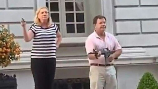 Mark and Patricia McCloskey pictured waving guns at Black Lives Matter protesters