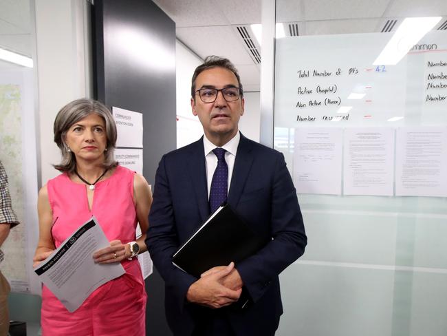 SA Premier Steven Marshall with SA Health chief Public health officer Nicola Spurrier at the new SA Health covid-19 command centre in Adelaide, Friday, March 20, 2020.  (AAP Image/Kelly Barnes) NO ARCHIVING