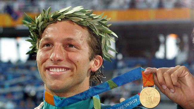 Ian Thorpe with one of his gold medals from the 2004 Olympic Games.