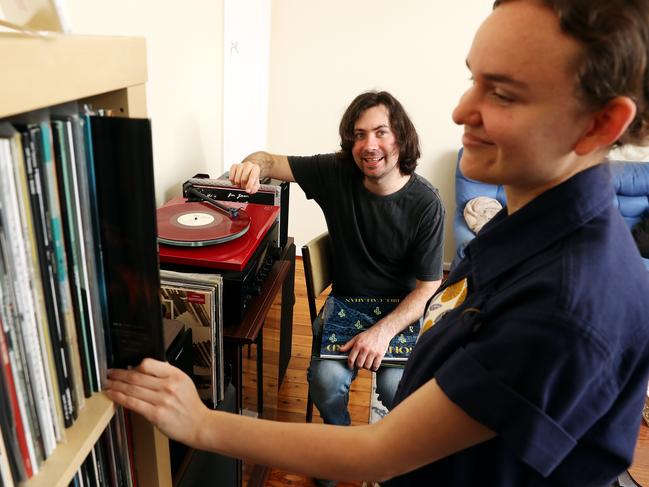 Vinyl enthusiasts Bradley Cork, 29, and Jade Smith, 26, spend less time on the train listening to digital music. Picture: Tim Hunter