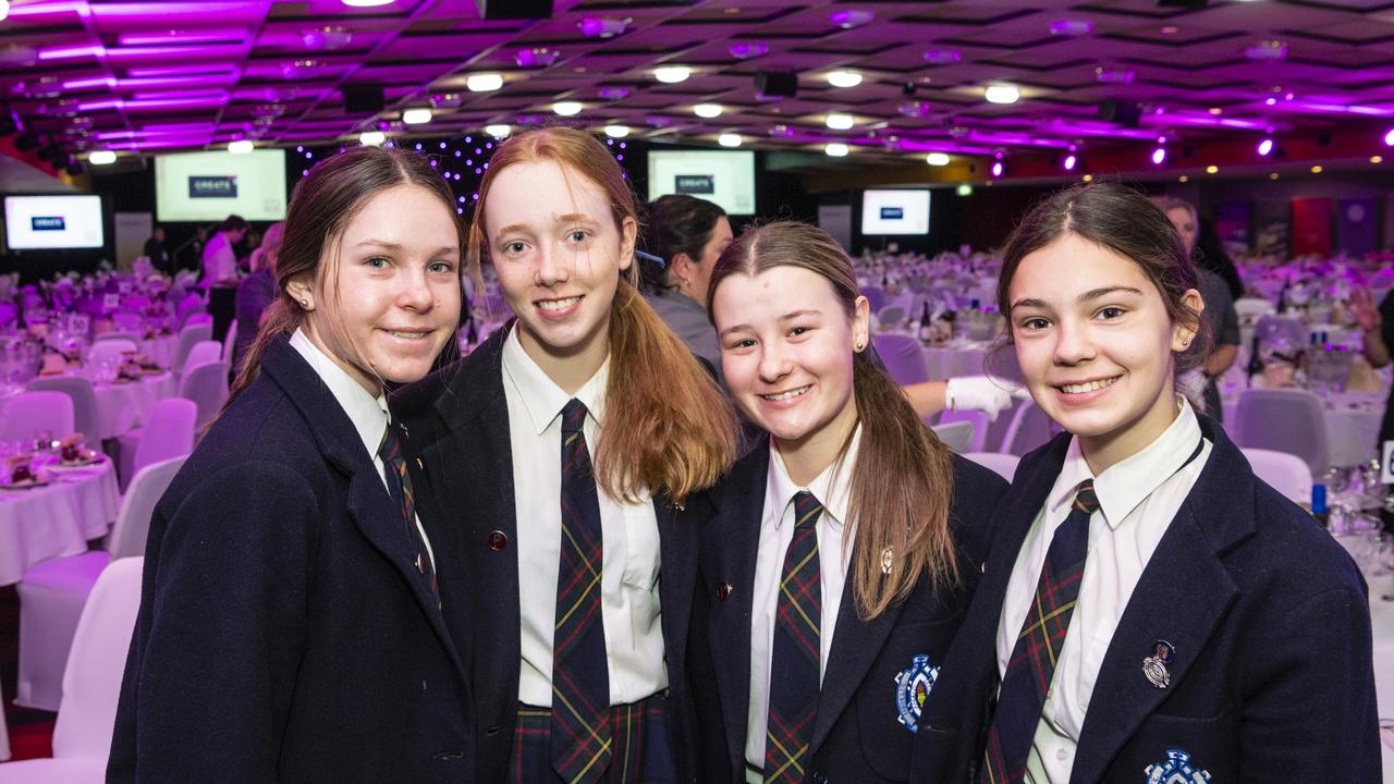 Fairholme College students (from left) Elka McClymont, Bella Brassington, Olivia Anderson and Emmi Lange welcome guests to the Women of Strength fundraiser for Toowoomba Hospital Foundation at Rumours International, Friday, August 19, 2022. Picture: Kevin Farmer